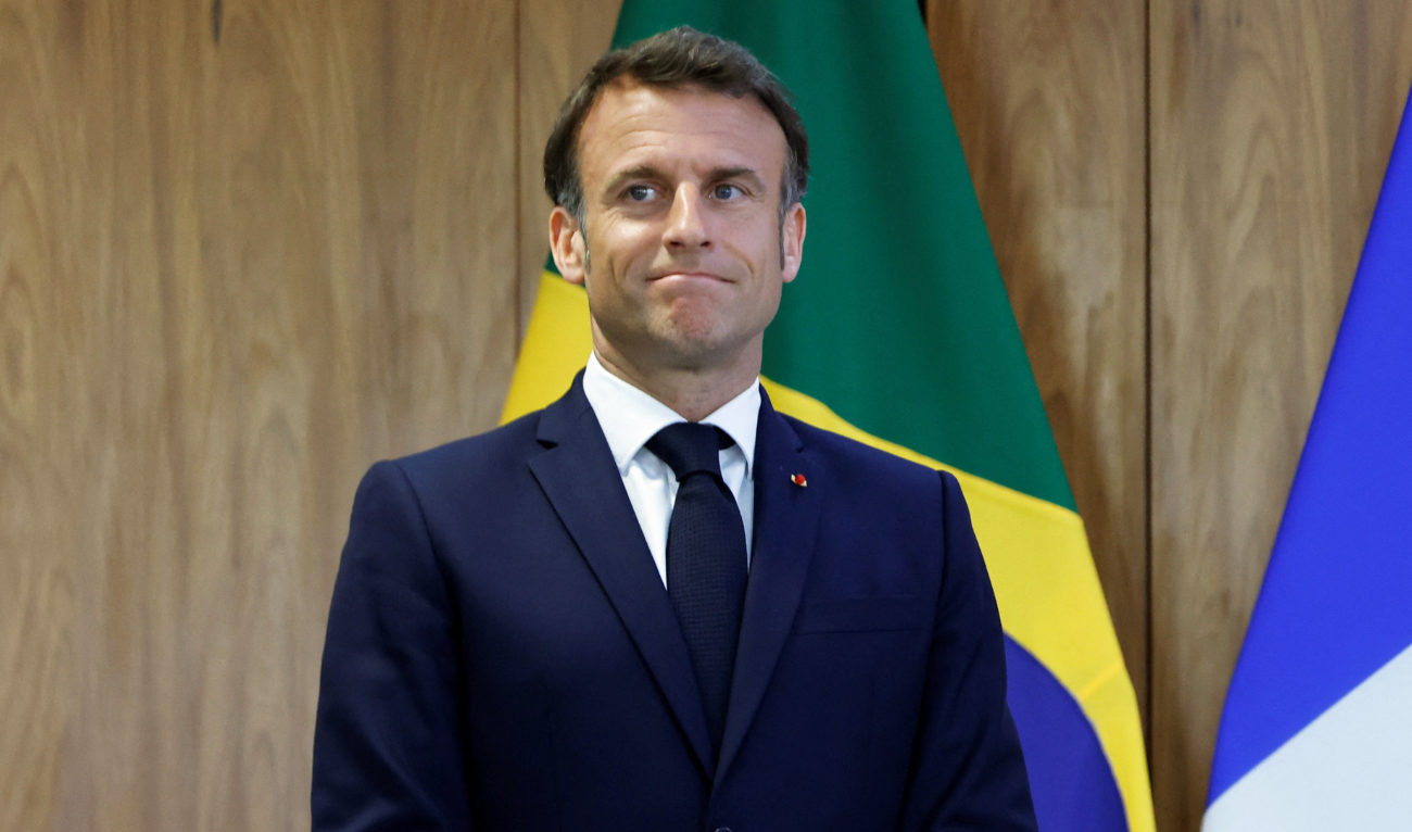 France’s President Emmanuel Macron gestures during the bilateral agreement signing ceremony at the Planalto Palace in Brasilia on March 28, 2024. (AFP)