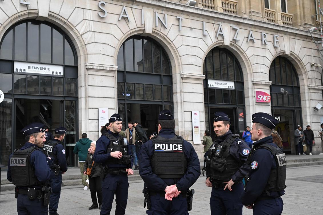 French police officers stand in front of the Saint-Lazare railway station in Paris on Mar. 25, 2024. (AFP)
