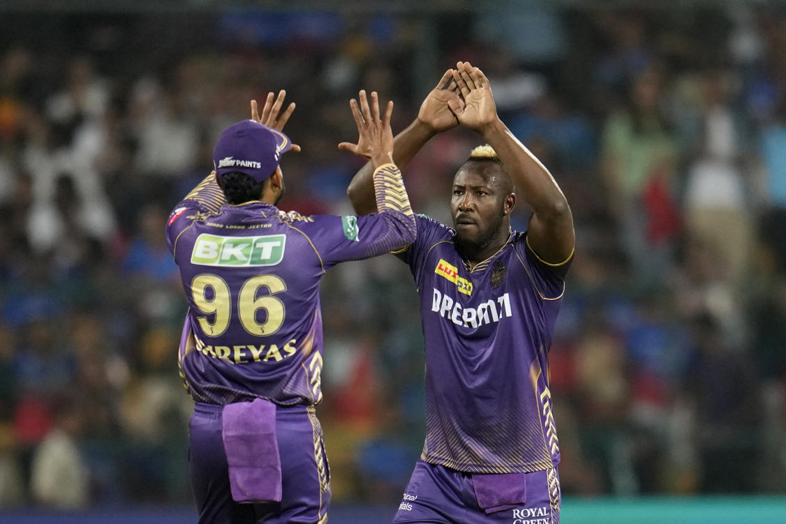 Kolkata Knight Riders’ Andre Russell, right, celebrates with captain Shreyas Iyer after the dismissal of Royal Challengers Bengaluru’s Cameron Green during the Indian Premier League cricket match between Royal Challengers Bengaluru and Kolkata Knight Riders in Bengaluru, India, Friday, March 29, 2024. (AP)