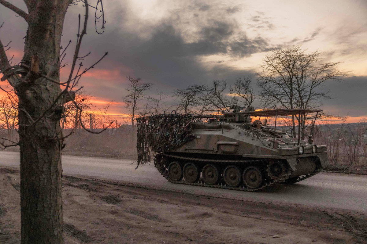 A Ukrainian serviceman drives a British FV103 Spartan armored personnel carrier in the Donetsk region on March 30, 2024. France on Saturday said it is also sending hundreds of APCs and missiles to Ukraine in a new aid package. (AFP)