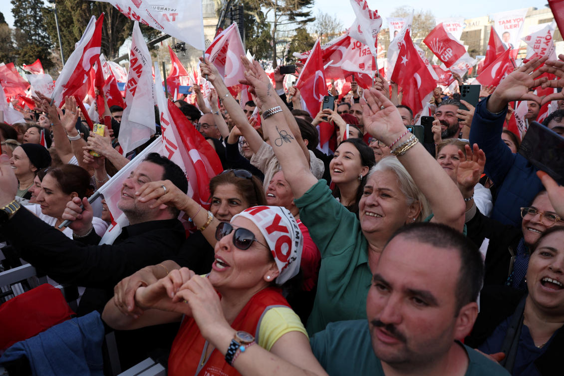 Supporters of Istanbul Mayor Ekrem Imamoglu, mayoral candidate of the main opposition Republican People's Party (CHP), cheer during a rally ahead of the local elections in Istanbul, Turkey March 30, 2024. (Reuters)