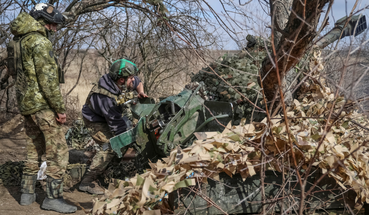 Ukrainian service members fire a 120-mm towed 2B16 "Nona-K" artillery-piece mortar towards Russian troops in Donetsk region.