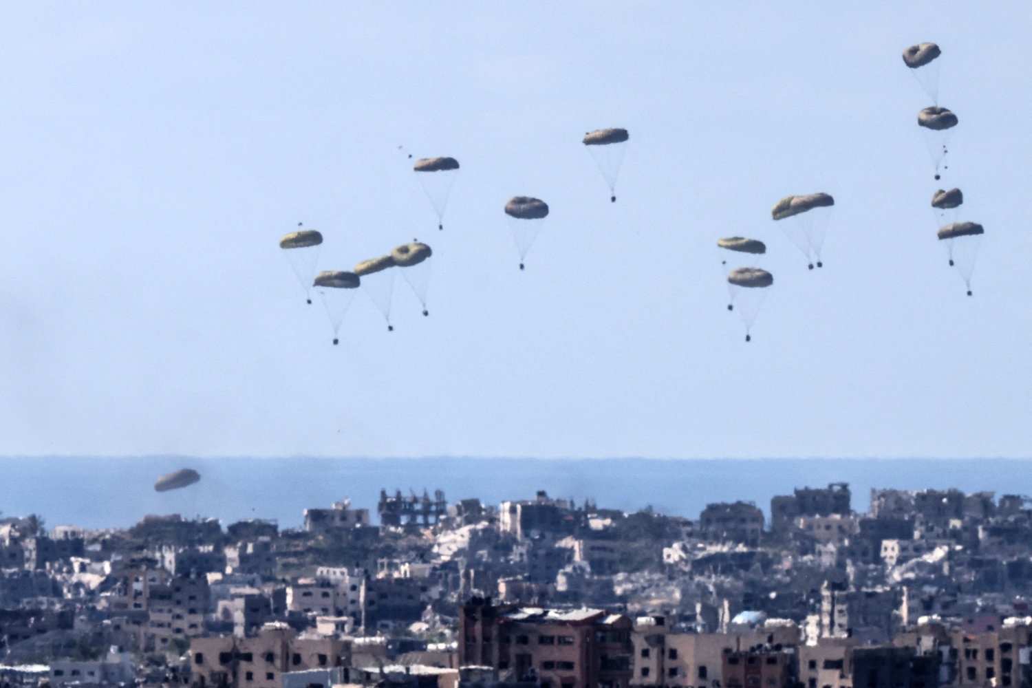 For the US to resort to aid drops when it could instruct Israel to open the land borders is extraordinary (File/AFP)