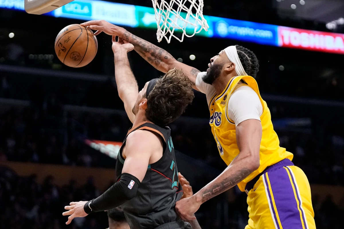 Washington Wizards forward Corey Kispert, left, has his shot blocked by Los Angeles Lakers forward Anthony Davis during the second half of an NBA basketball game Thursday in Los Angeles. (AP)