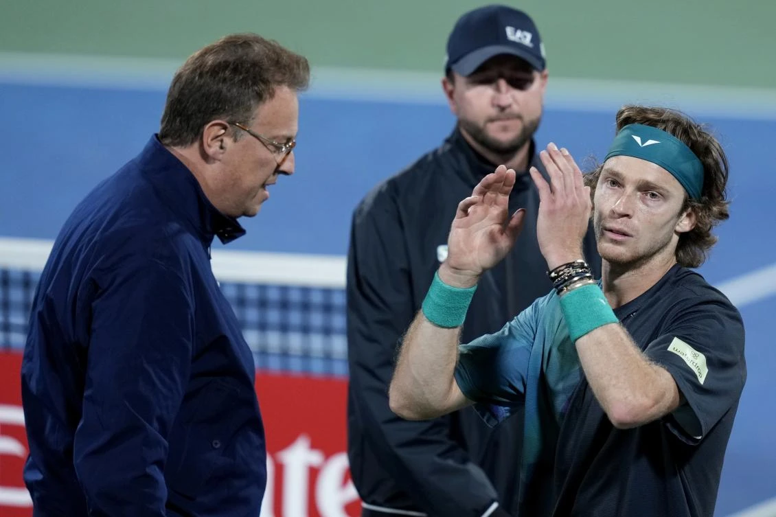ATP Supervisor Roland Herfel, left, disqualifies Andrey Rublev during his semi final match with Alexander Bublik of Kazakhstan at the Dubai Duty Free Tennis Championships in Dubai on March 1, 2024. (AP)