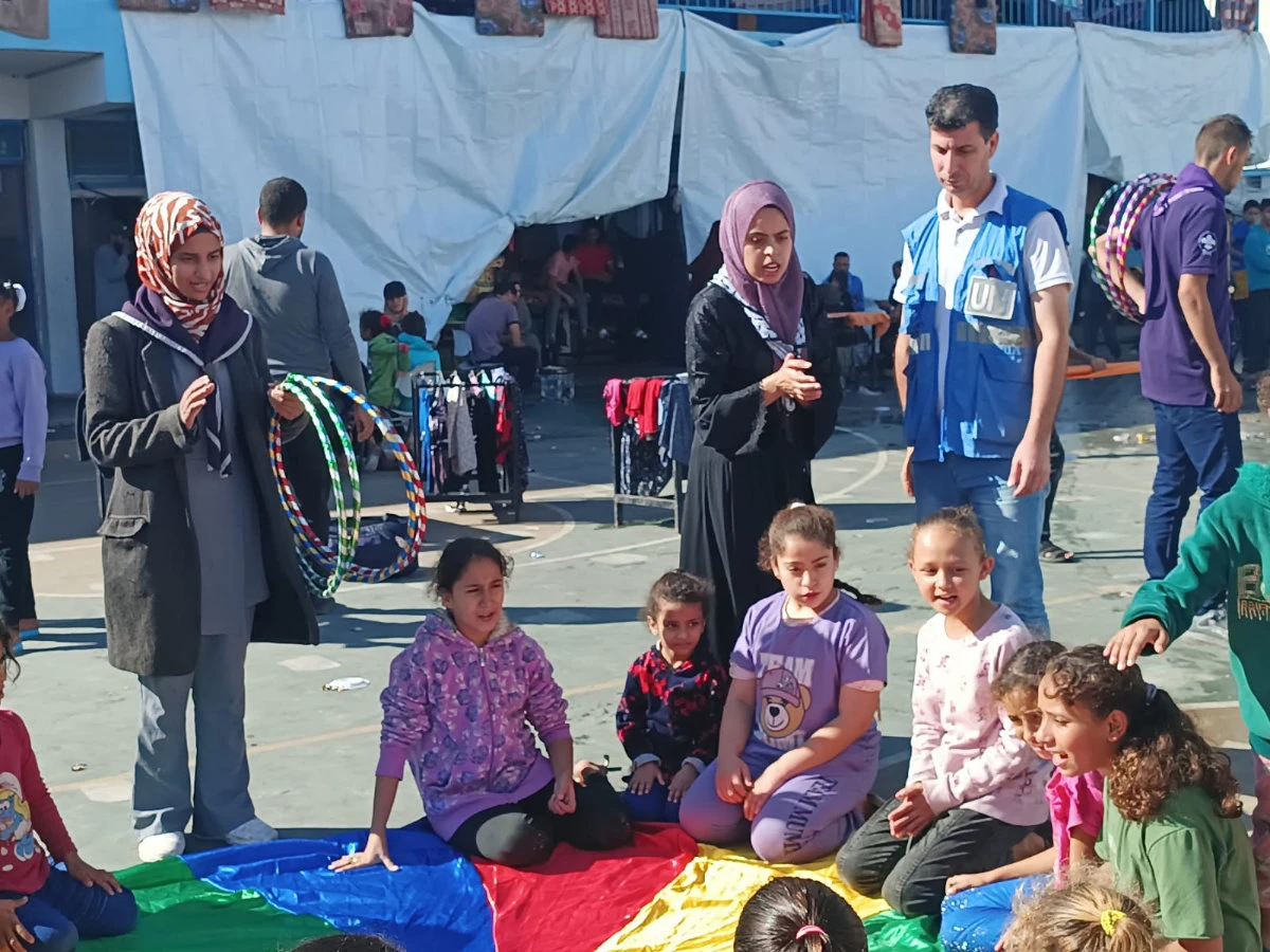 Palestinian Scout Association members volunteer to assist displaced people in war-torn Gaza