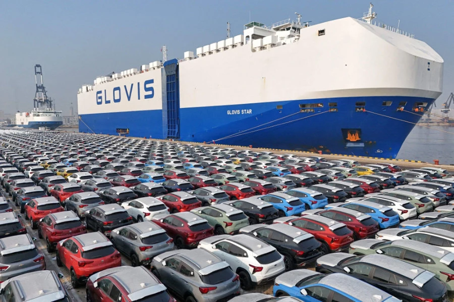 This file photo taken on January 2, 2024, shows cars waiting to be loaded onto a ship for export at the port in Yantai, in China's eastern Shandong province. (AFP)