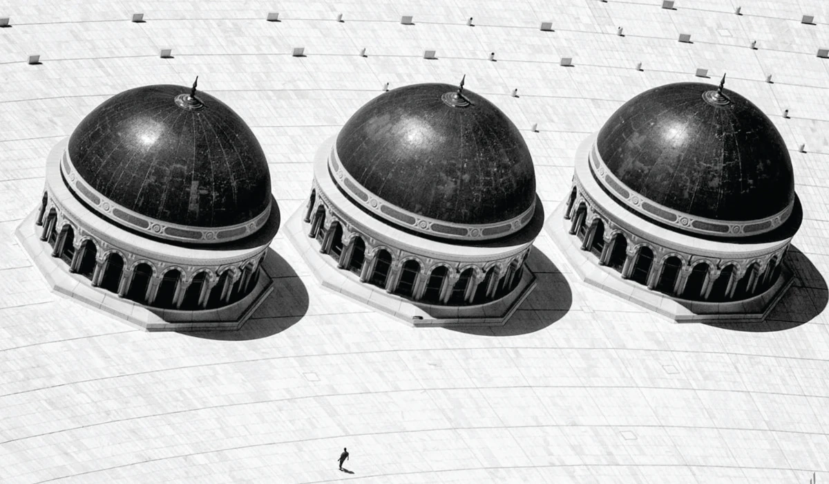 Raed Abdullah Al-Maliki captured an award-winning photo, main, of the Grand Mosque domes from a helicopter during Hajj season, showcasing their size in relation to a solitary figure on the roof. (Supplied)