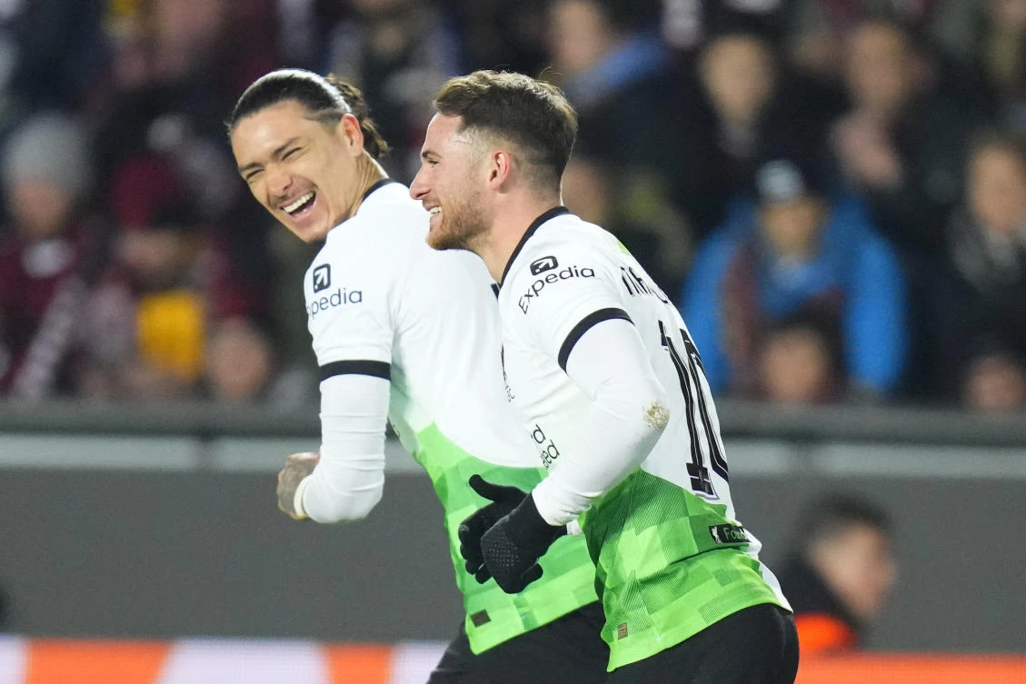 Liverpool’s Alexis Mac Allister celebrates Darwin Nunez after scoring his side’s first goal from the penalty spot during their Europa League round of 16 first leg, match against Sparta Praha at the Epet Arena in Prague on Mar. 7, 2024. (AP)