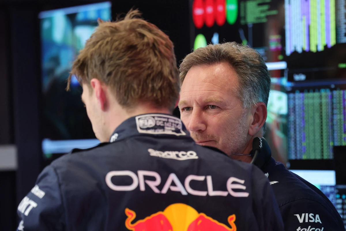Red Bull Racing team principal Christian Horner (R) talks to Red Bull Racing’s Dutch driver Max Verstappen at the Saudi Arabian Formula One Grand Prix at the Jeddah Corniche Circuit. (AP)