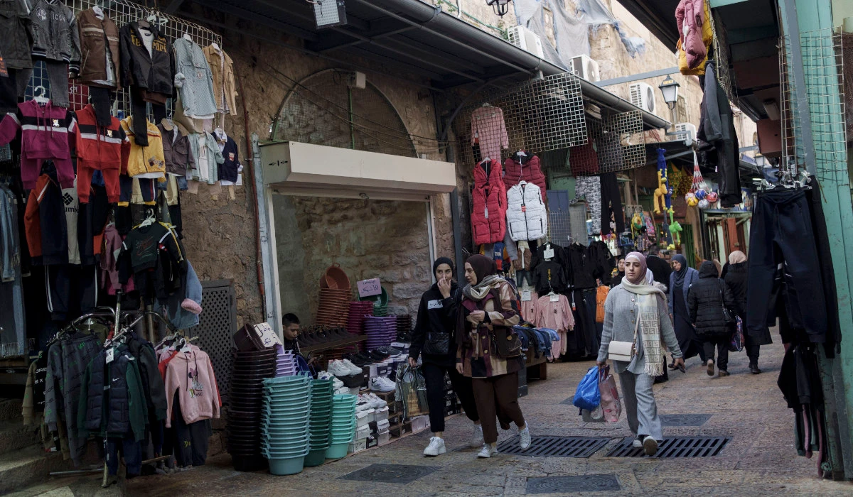 Muslim women walk through a market, ahead of the holy Islamic month of Ramadan, in the Old City of Jerusalem, Thursday, March 7, 2024. (AP)