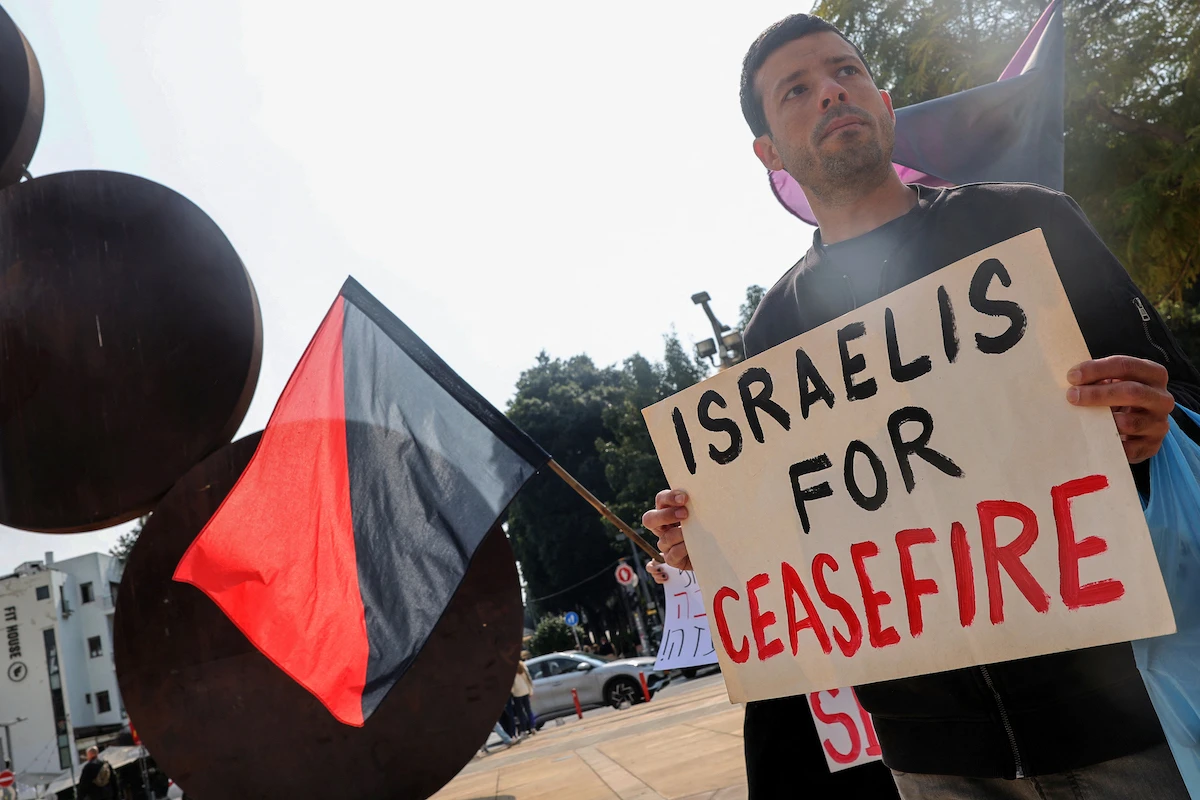 Demonstrators gather with signs during a protest by Israeli left-wing activists against the war in the Gaza Strip and calling for the immediate ceasefire and for the release of the kidnapped hostages, in Tel Aviv. (File/AFP)