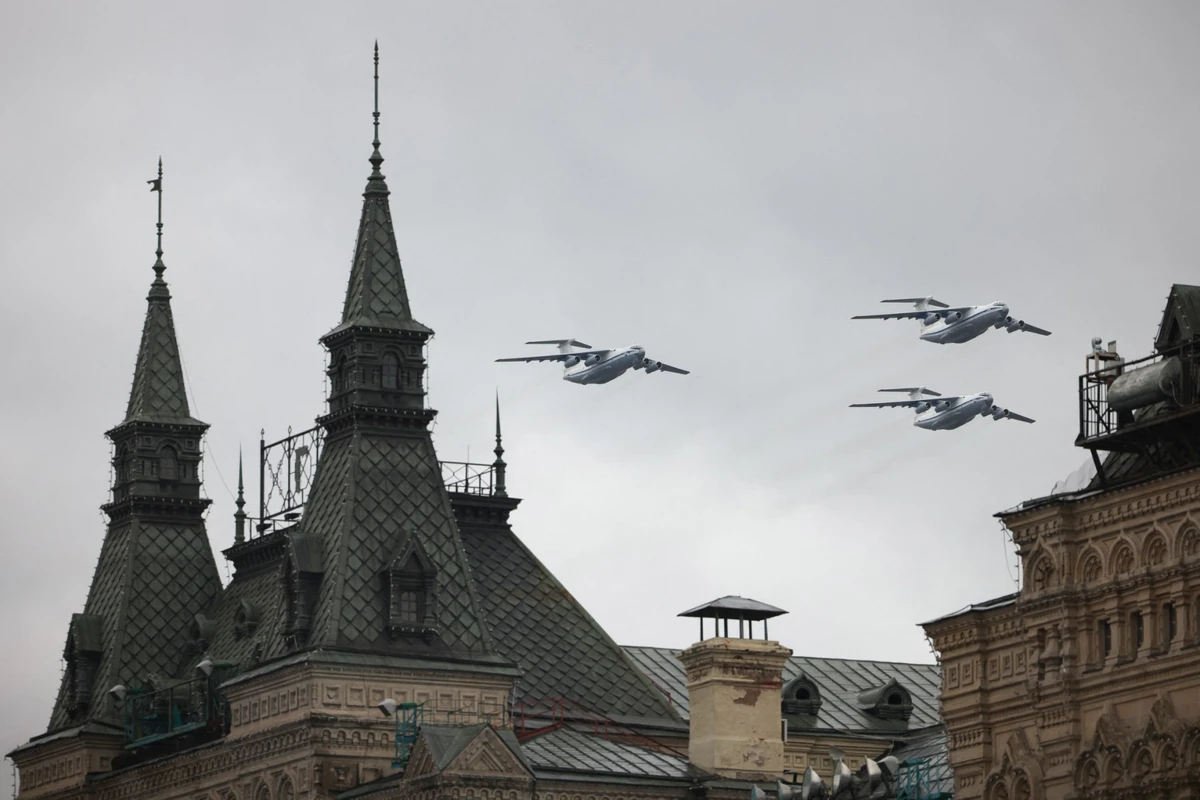 Russian Ilyushin Il-76 planes fly over the GUM department store during the Victory Day military parade in Moscow on May 9, 2021. (AFP)