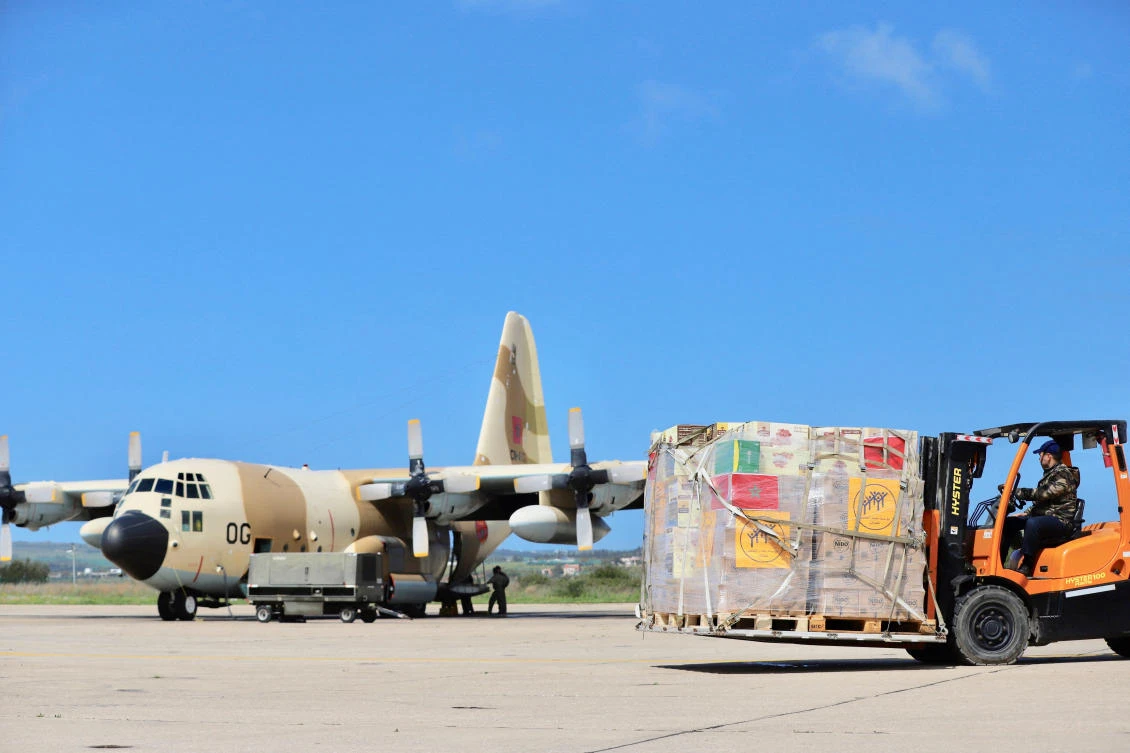 A person uses a forklift to move humanitarian aid to be loaded into a military airplane and to be sent to Gaza via land through the Kerem Shalom crossing in Israel, according to a Moroccan diplomatic source, in Morocco, on Mar. 12, 2024. (Reuters)
