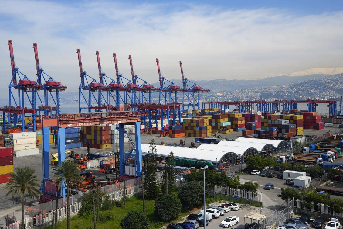Gantry cranes move containers onto transporters at the Beirut Port, in Beirut, on Mar. 13, 2024. (AP)