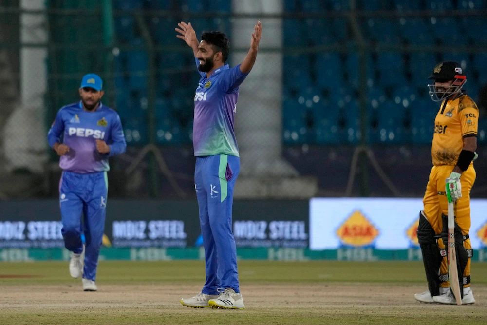 Multan Sultans’ Usama Mir, center, celebrates after taking a wicket during the PSL qualifier match against Peshawar Zalmi. (AP)
