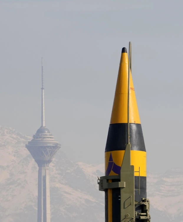 An Iranian-built missile is displayed during a rally as Milad telecommunication tower is seen at background, in Tehran, on Feb. 11, 2024. (AP/File)
