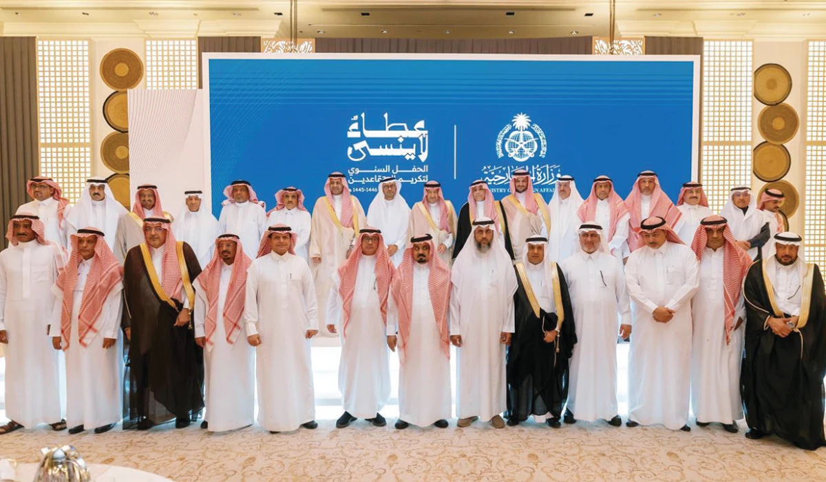 Retirees pose for a group photo with Saudi Foreign Ministry officials in Riyadh. (Supplied)