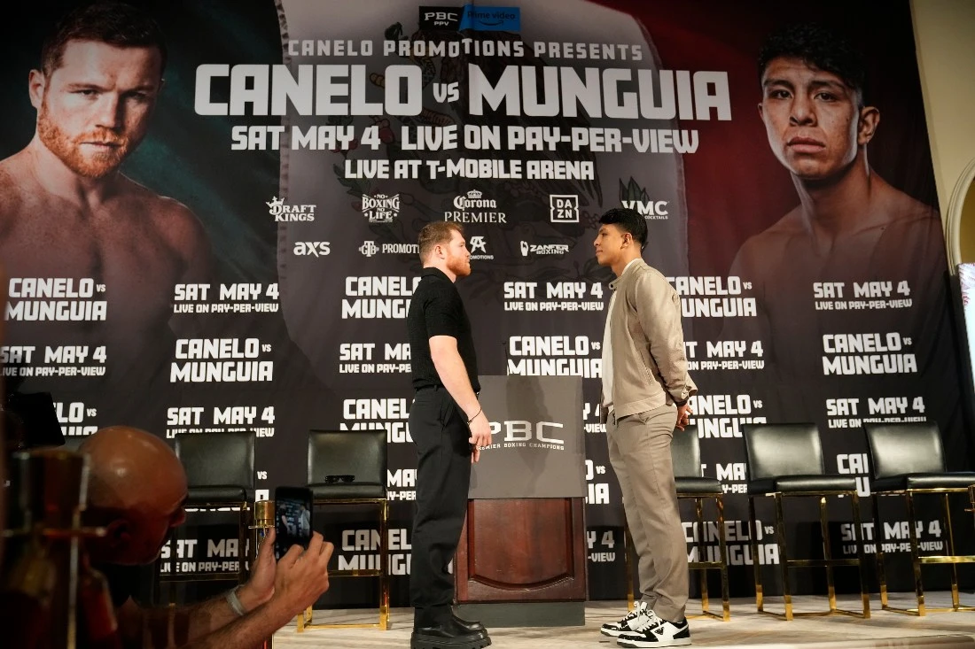 Undisputed super middleweight champion Canelo Alvarez, left, poses with boxer Jaime Munguia during a news conference in Beverly Hills, Calif., Tuesday. Alvarez will defend his titles against All-Action Star Jaime Munguia on May 4, at T-Mobile Area in Las Vegas. (AP)