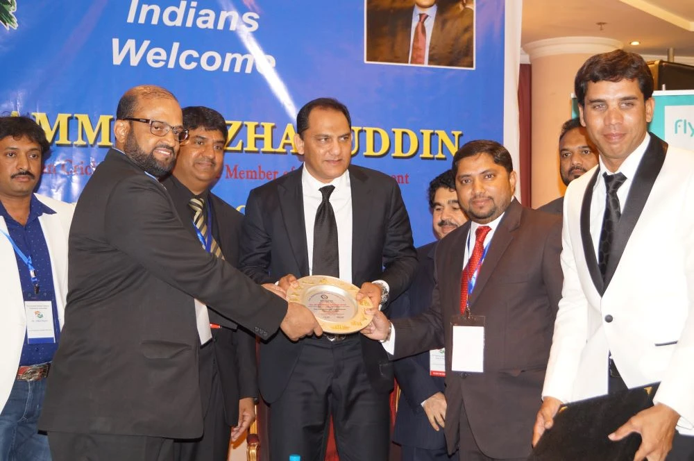 GKIISC president Dr. Gayas Ahmed Sattar and co-founder Mohammed Kaleem present a memento to former Indian cricket captain Mohammed Azharuddin, center, in Riyadh. (Supplied)