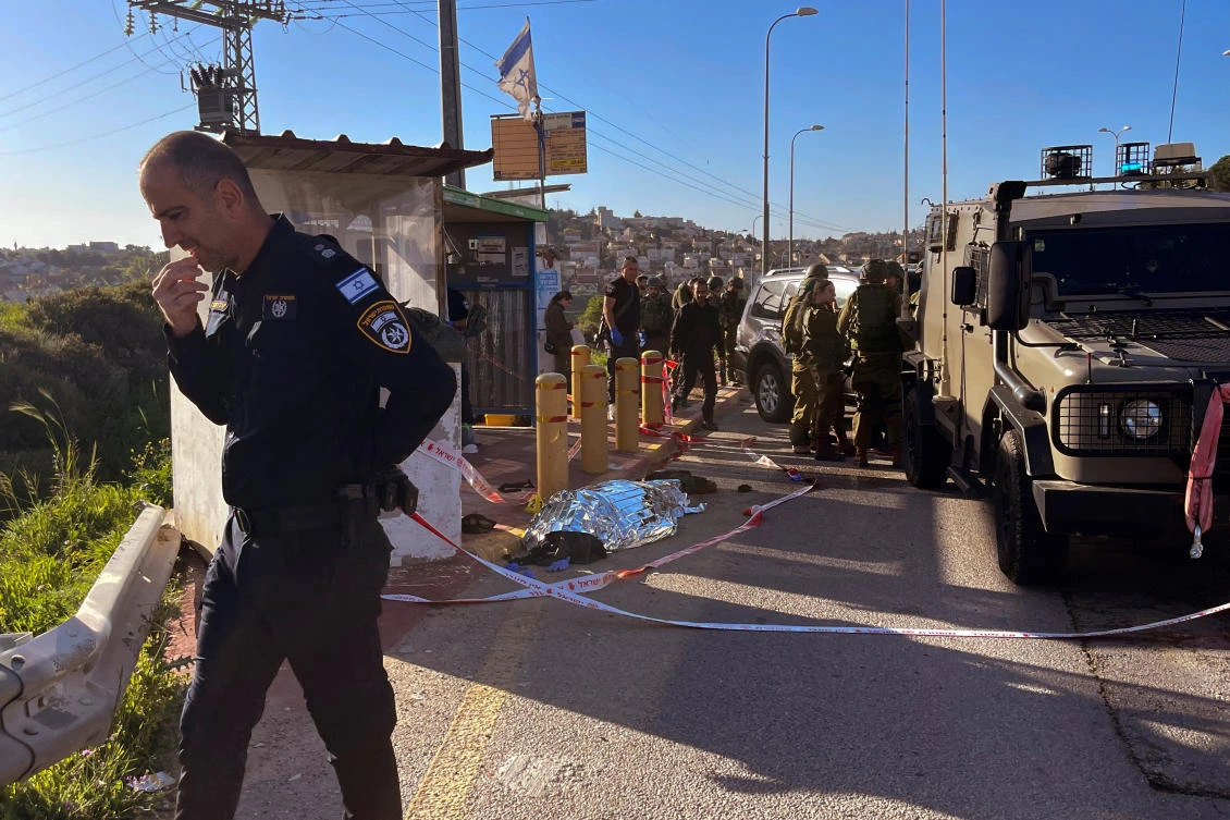 Israeli forces work at the scene of a suspected attack near the settlement of Elazar in the Israeli-occupied West Bank, on Mar. 21, 2024. (Reuters)