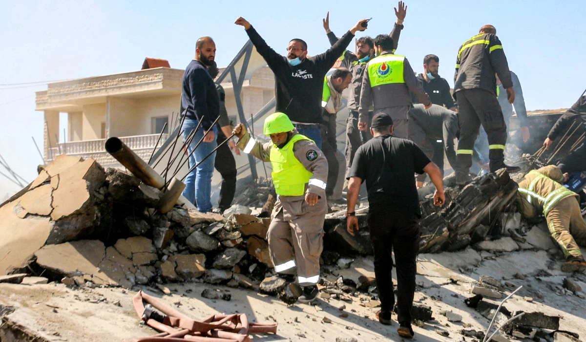Lebanese civil defence members search the rubble of a destroyed building in the aftermath of an Israeli airstrike on the village of Sarein, near Baalbek in east central Lebanon. (AFP file photo)