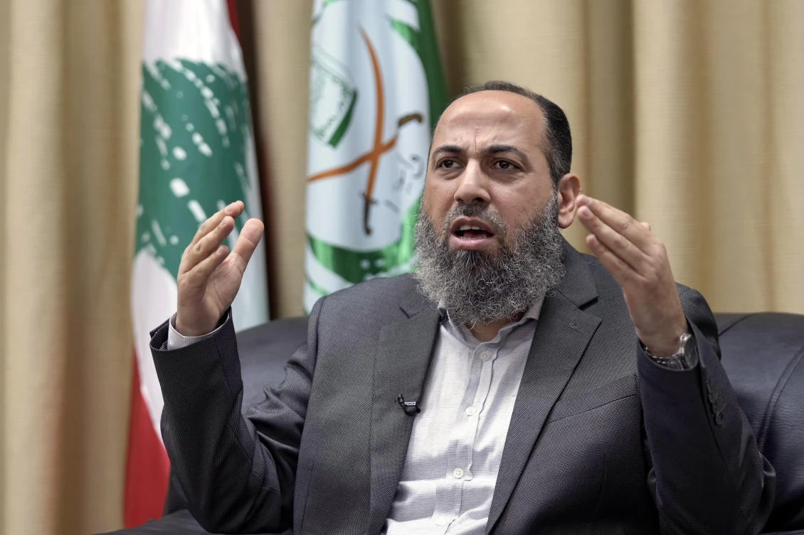 The Secretary-General of the Islamic Group Sheikh Mohammed Takkoush, speaks during an interview with AP in Beirut on Mar. 26, 2024. (AP)