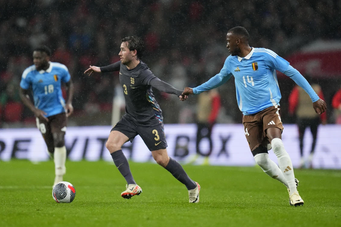 England’s Ben Chilwell, left, is challenged by Belgium’s Dodi Lukebakio during their international friendly match against Belgium at Wembley Stadium on Mar. 26, 2024. (AP)