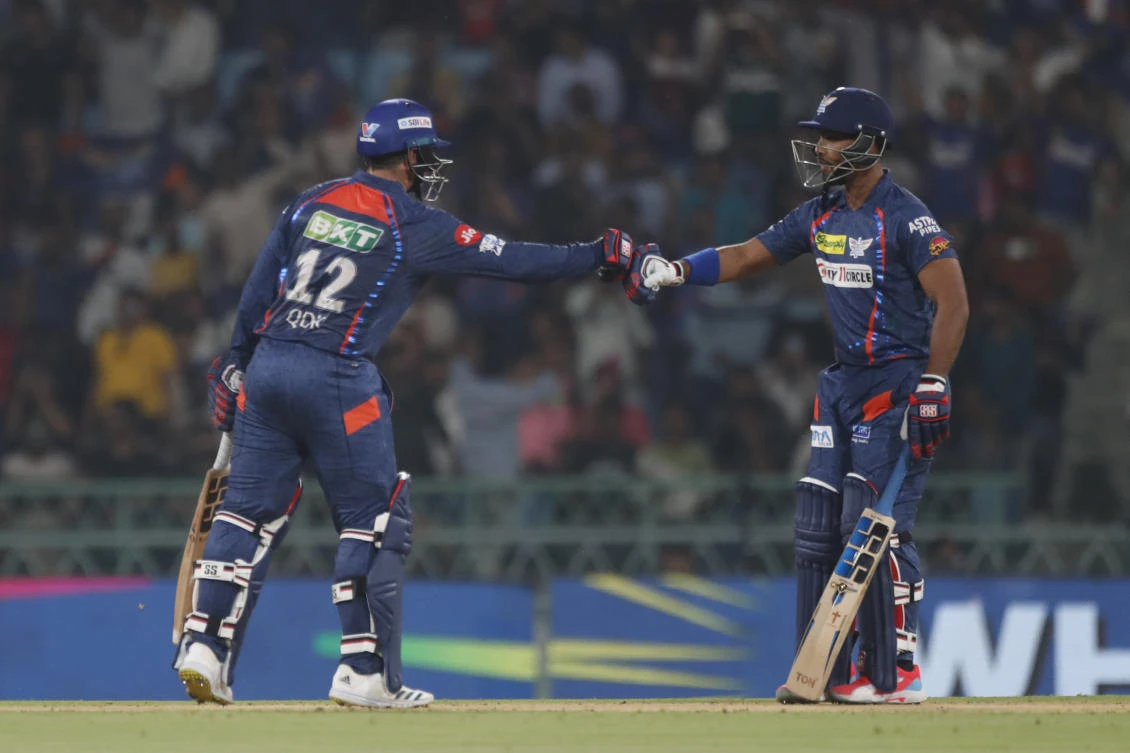 Lucknow Super Giants’ Quinton de Kock, left, fist bumps with batting partner Nicholas Pooran during the Indian Premier League cricket match between Lucknow Super Giants and Punjab Kings in Lucknow, India, Saturday, March 30, 2024.(AP)