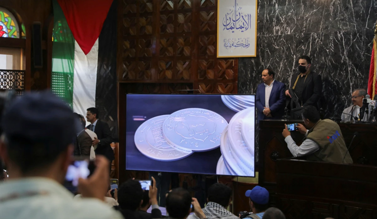 A new coin currency issued by the Houthi-run Sanaa-based Central Bank of Yemen is displayed on a screen during a press conference in Sanaa, Yemen, March 30, 2024. (REUTERS)