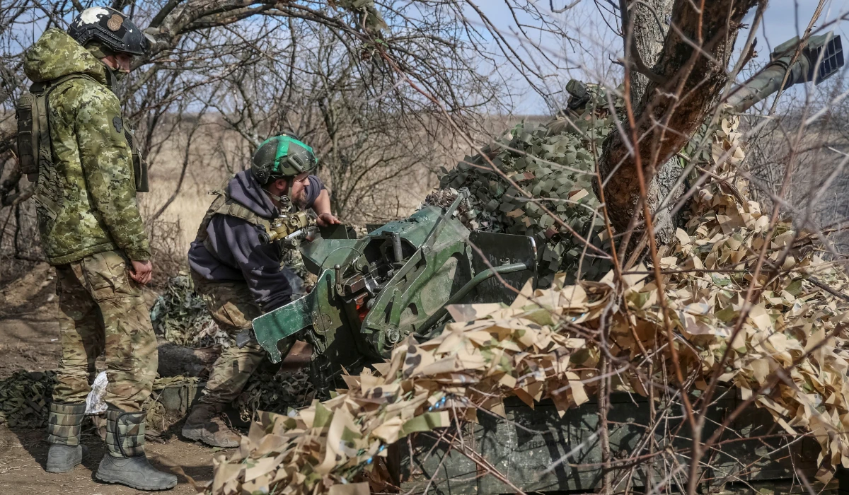 Ukrainian service members fire a 120-mm towed 2B16 "Nona-K" artillery-piece mortar towards Russian troops in Donetsk region.