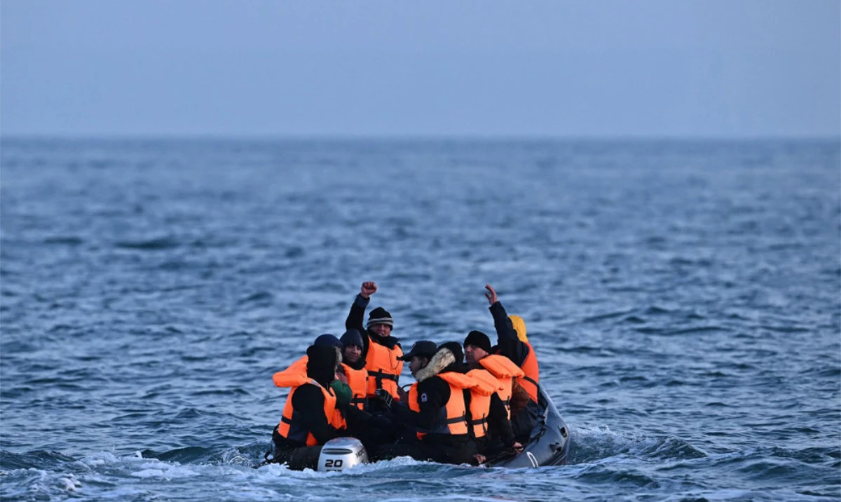Migrants travel in an inflatable boat across the English Channel, bound for Dover on the south coast of England. (AFP)