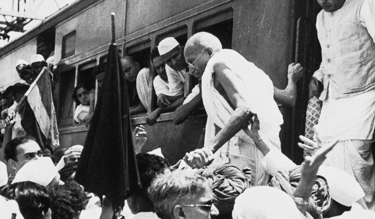 National Congress Party leader Mahatma Gandhi, center, disembarks from a train in Bombay, India. (AP file photo)