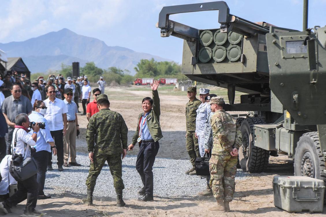 Philippine President Ferdinand Marcos (C) said the Philippines will not be "cowed into silence" by Beijing after confrontations in the South China Sea that left Filipino troops injured and its vessels damaged. (File/AFP)