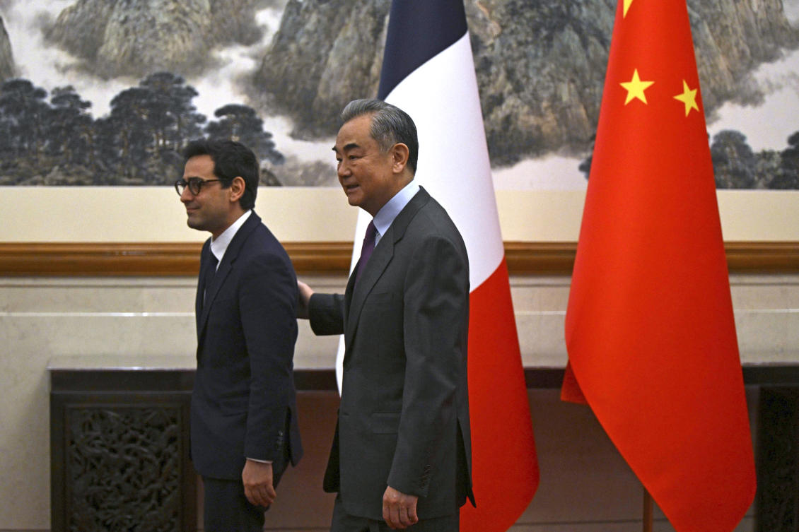 France's Minister for Foreign and European Affairs Stephane Sejourne, left, is escorted by China's Foreign Minister Wang Yi during a meeting at the Diaoyutai State Guest House in Beijing, China Monday, April 1, 2024. (AP)