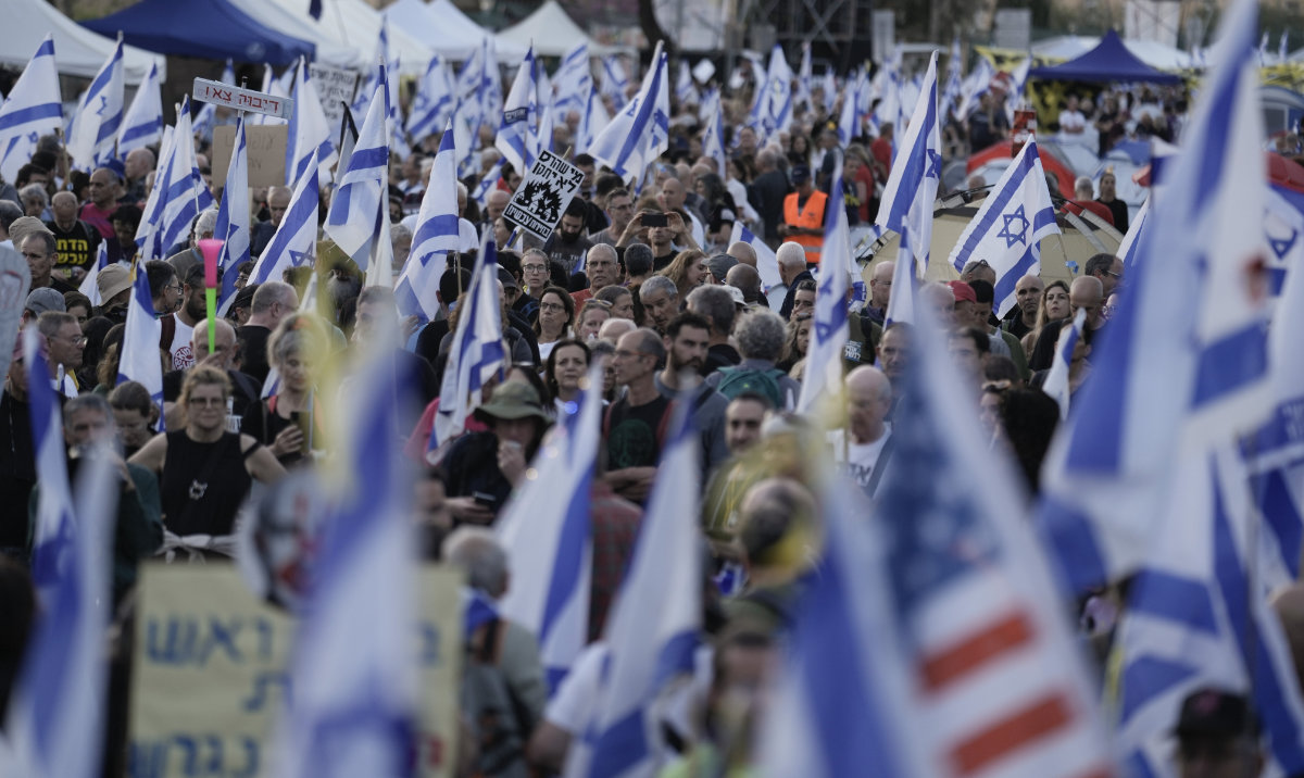 People take part in a protest against Israeli Prime Minister Benjamin Netanyahu's government and call for the release of hostages held in the Gaza Strip by the Hamas militant group outside of the Knesset, Israel's parliament, in Jerusalem, Monday, April 1, 2024. (AP)