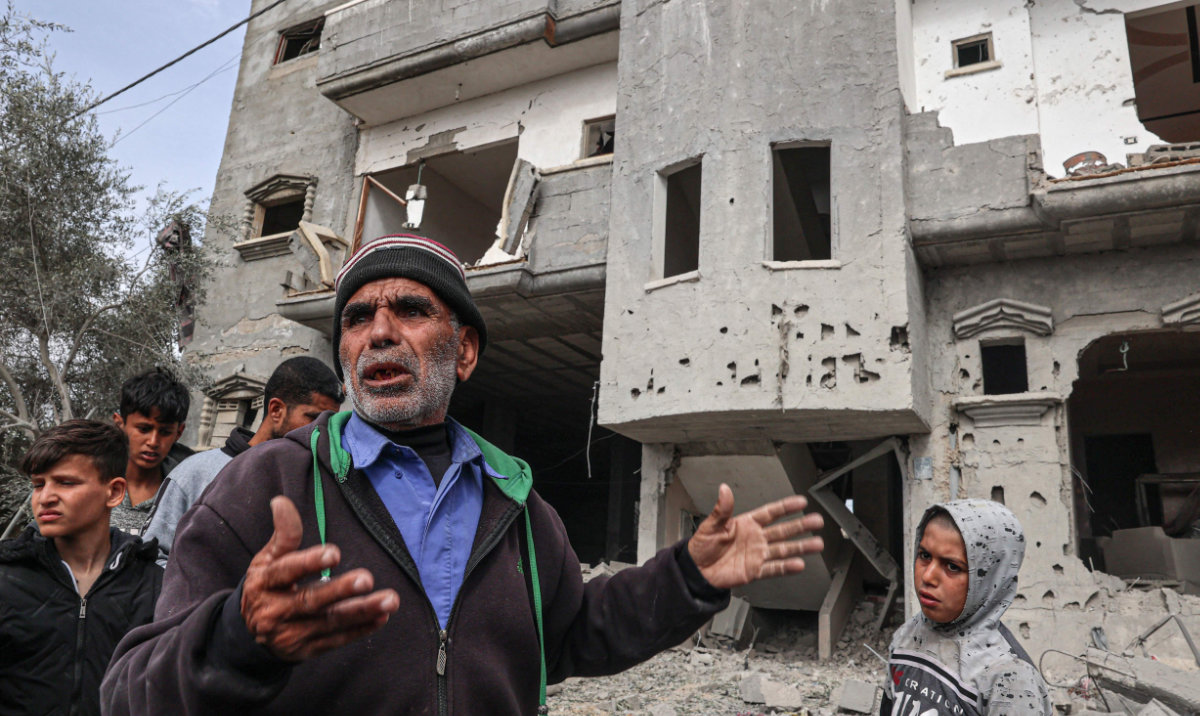 Palestinians inspect the damage to a building after overnight Israeli bombardment in Rafah in the southern Gaza Strip. (AP)