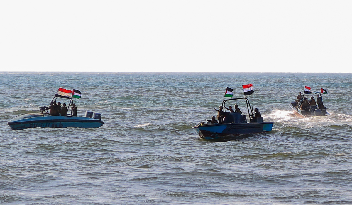 Members of the Yemeni Coast Guard affiliated with the Houthi group patrol the sea as demonstrators march through the Red Sea port city of Hodeida in solidarity with the people of Gaza. (AFP file photo)