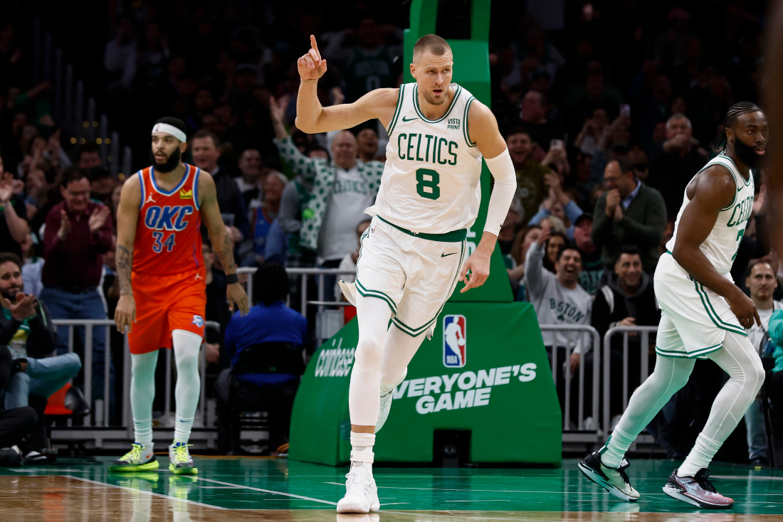 Boston Celtics' Kristaps Porzingis heads back upcourt after making a 3-point basket against the Oklahoma City Thunder during the second half of an NBA basketball game in Boston. (AP)