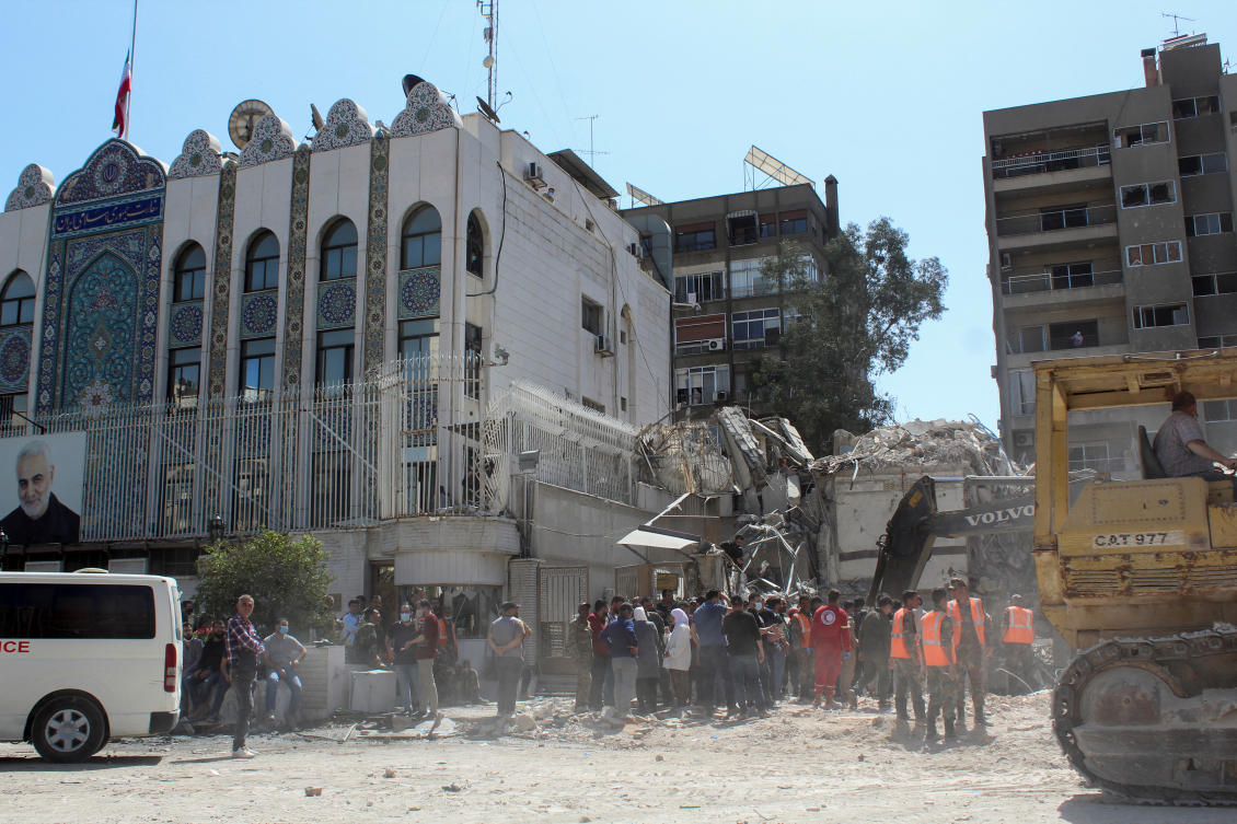 Civil defense members and workers clear rubble after a suspected Israeli strike on Monday on Iran’s consulate killing seven military personnel including two key figures in the Quds Force, in Damascus on Apr. 2, 2024. (Reuters)