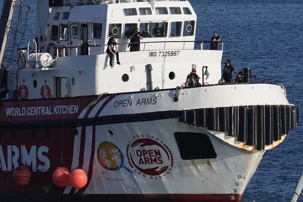 The workers were moving food and supplies sent in a second shipload from Cyprus when their convoy was attacked on Monday. (AP)