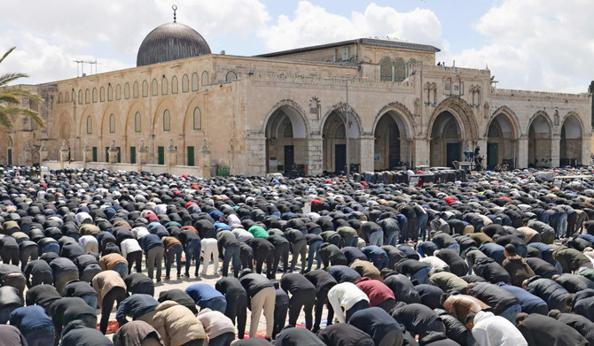 Palestinian Muslim devotees perform noon prayers on the second Friday of the Islamic holy fasting month of Ramadan in the Al-Aqsa mosque compound in the Old City of Jerusalem. (AFP/File Photo)