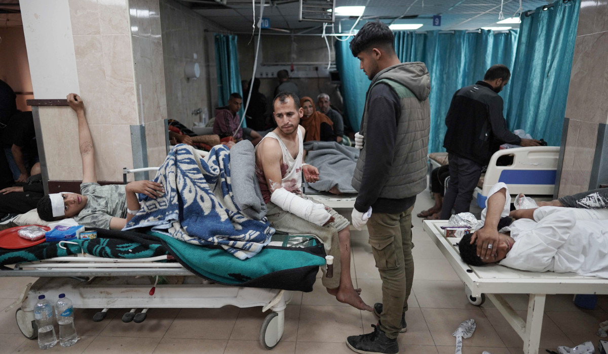 Injured Palestinians receive treatment at the Shuhada Al-Aqsa Hospital in Deir El-Balah in the central Gaza Strip amid the ongoing conflict between Israel and Hamas. (AFP)