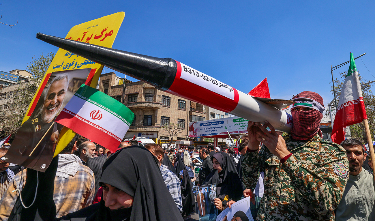 Iranian attend the funeral procession for seven Islamic Revolutionary Guard Corps members killed in a strike in Syria, which Iran blamed on Israel, in Tehran on April 5, 2024. (AFP)