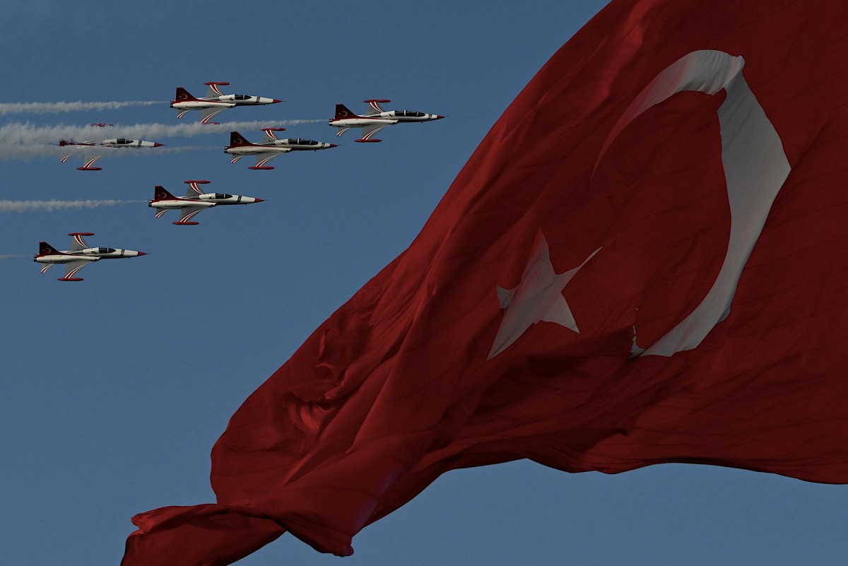 Turkish Air force pilots of the 'Turkish Stars' fly in Northrop F-5 near a national flag to mark the 100th anniversary of Turkish Republic in Istanbul on October 29, 2023. (File/AFP)