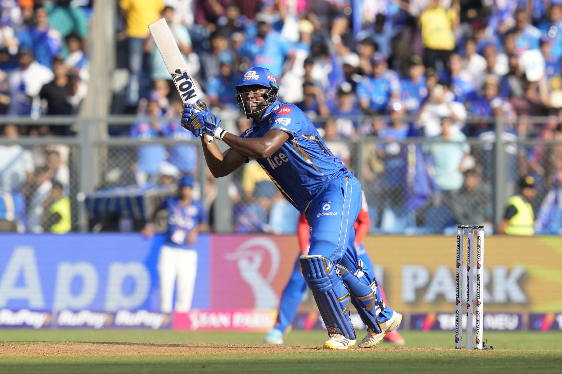 Mumbai Indians’ Romario Shepherd plays a shot during the Indian Premier League cricket match between Mumbai Indians’ and Delhi Capitals’ in Mumbai, India, Sunday, April. 7, 2024. (AP)