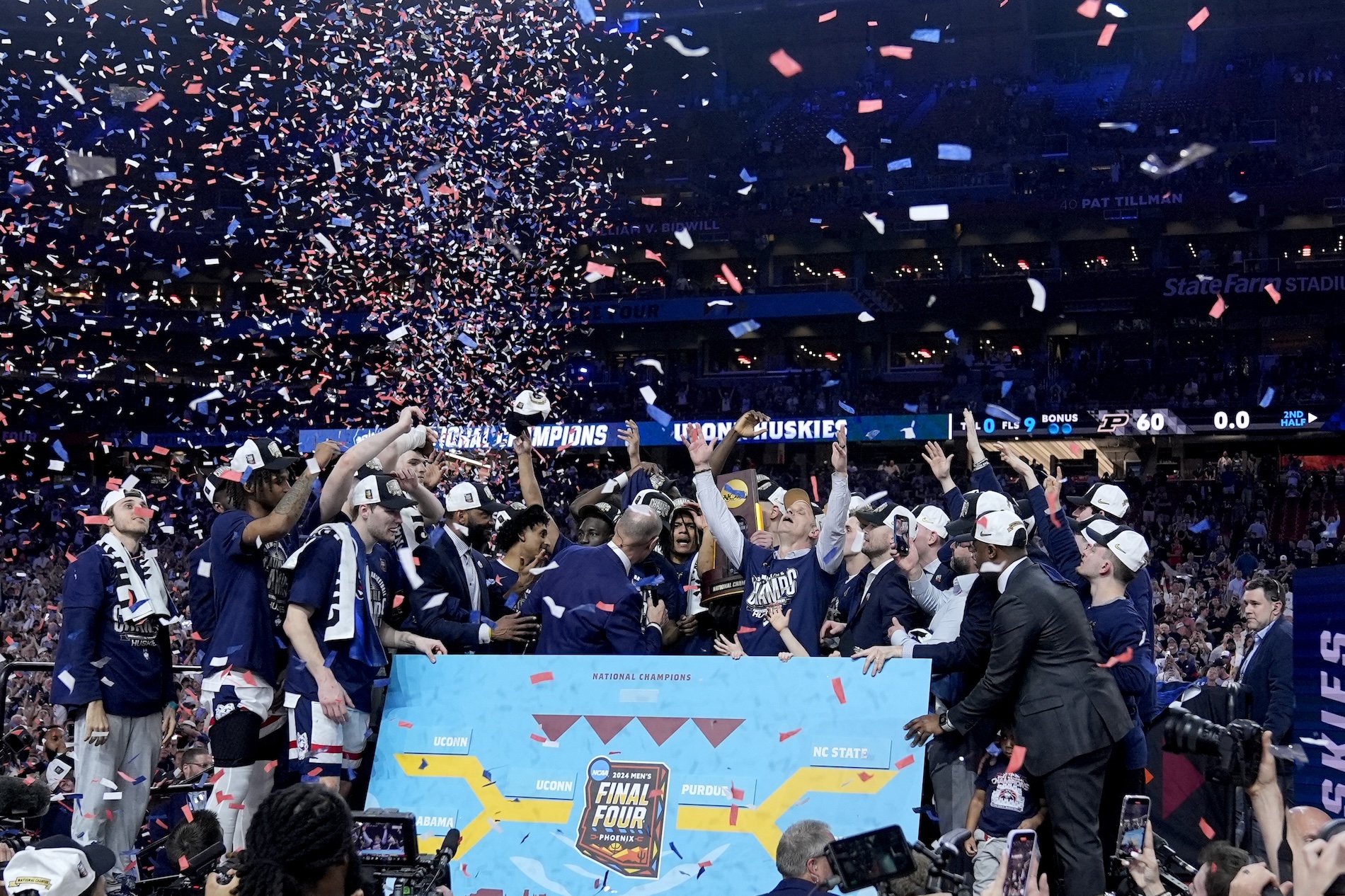 UConn players celebrate after the NCAA college Final Four championship basketball game against Purdue Monday in Glendale, Ariz. (AP)