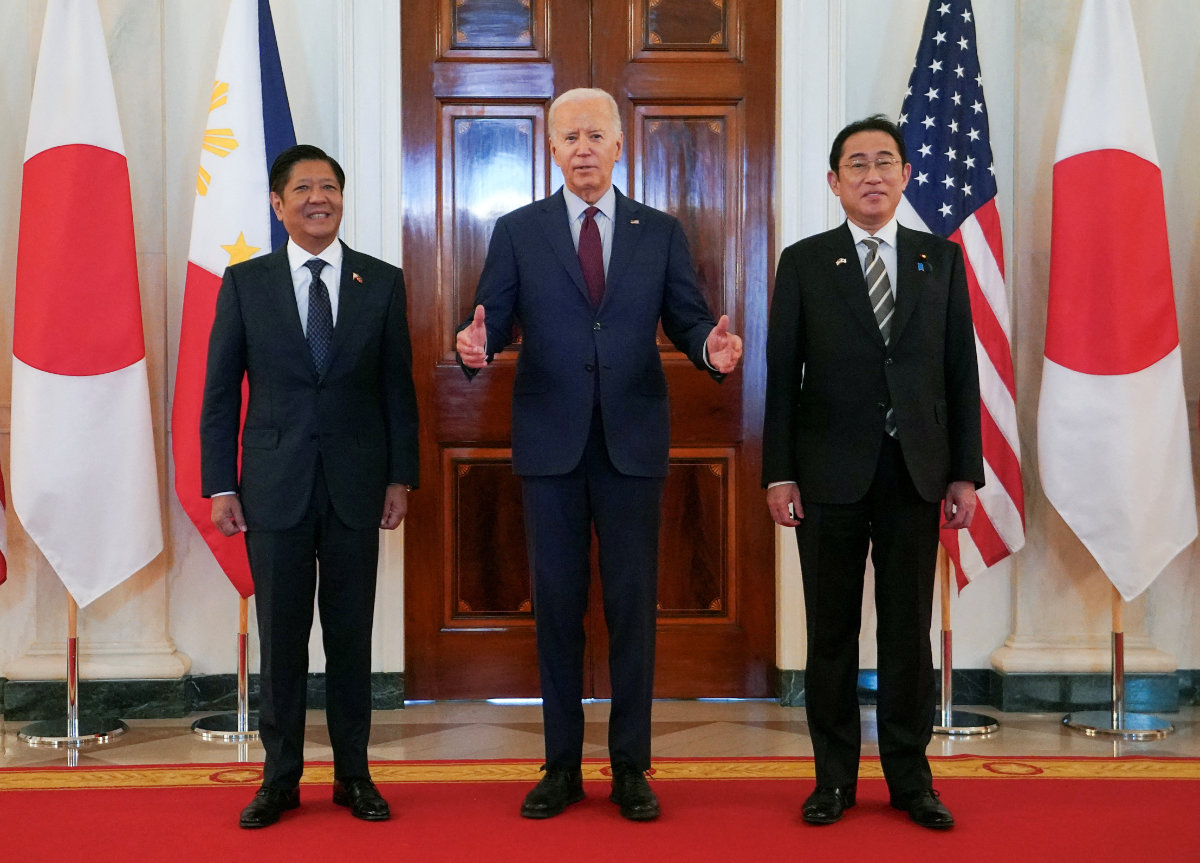 US President Joe Biden speaks while escorting Philippines President Ferdinand Marcos Jr. and Japan Prime Minister Fumio Kishida to their trilateral summit at the White House in Washington on April 11, 2024. (Reuters)