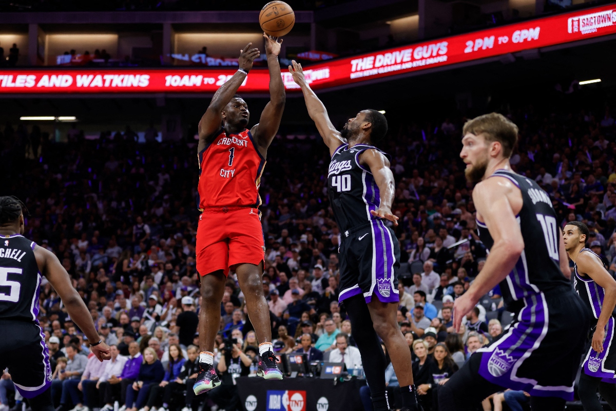 New Orleans Pelicans forward Zion Williamson shoots the ball against Sacramento Kings forward Harrison Barnes (40) during the third quarter of an NBA basketball game at Golden 1 Center Thursday. (USA TODAY Sports)