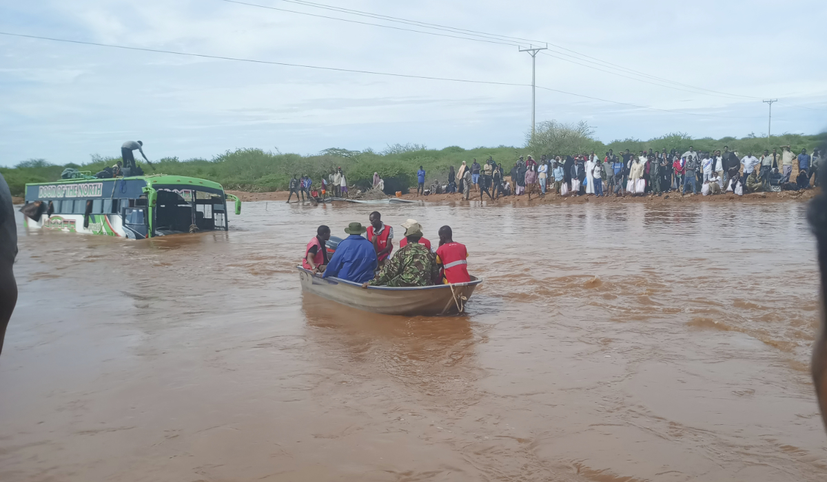 Passengers of a bus that was swept away by floodwaters are rescued by boat, near Garissa, northern Kenya, Tuesday, April 9, 2024. (AP)